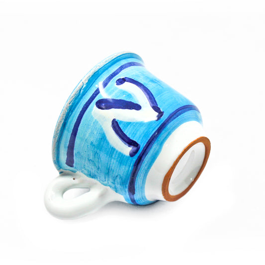 Tazzina artigianale azzurra in terracotta smaltata decorata con la lettera N ispirata al Napoli Calcio, realizzata a mano dal brand Pil Pil Design Partenopeo.