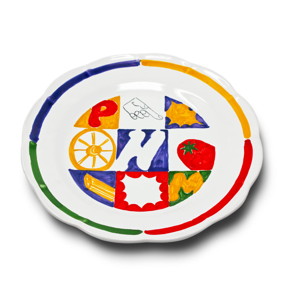 
Piatto artigianale in terracotta di pasta rossa smaltata dipinto a mano con simboli colorati della tradizione napoletana come la N di Napoli  la M del mercato  la P di pizza e pasta, ruota di carro, pomodoro e motivi geometrici vivaci.
