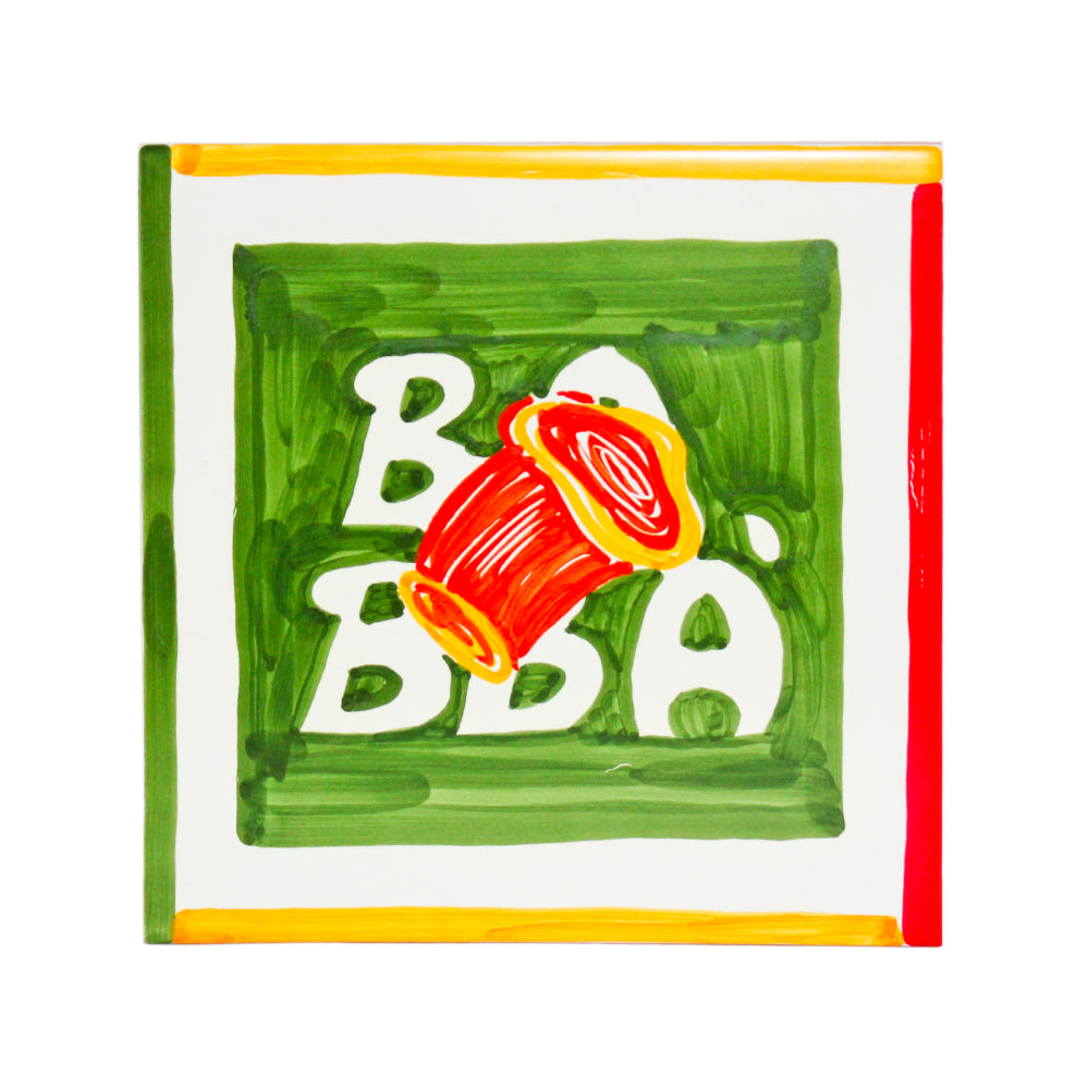 Maiolica napoletana artigianale dipinta a mano con pattern colorato di baba su sfondo verde  decorazione ceramica unica